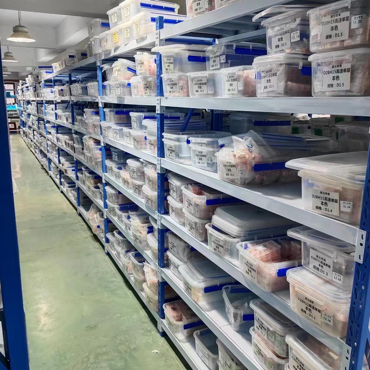 Laser accessory parts arranged in labeled storage bins